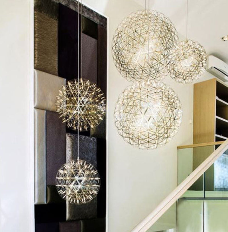 Chrome-plated LED firework/starburst pendant light, featuring a dandelion-inspired design, suitable for high-ceiling spaces such as staircases, foyers, and entryways.