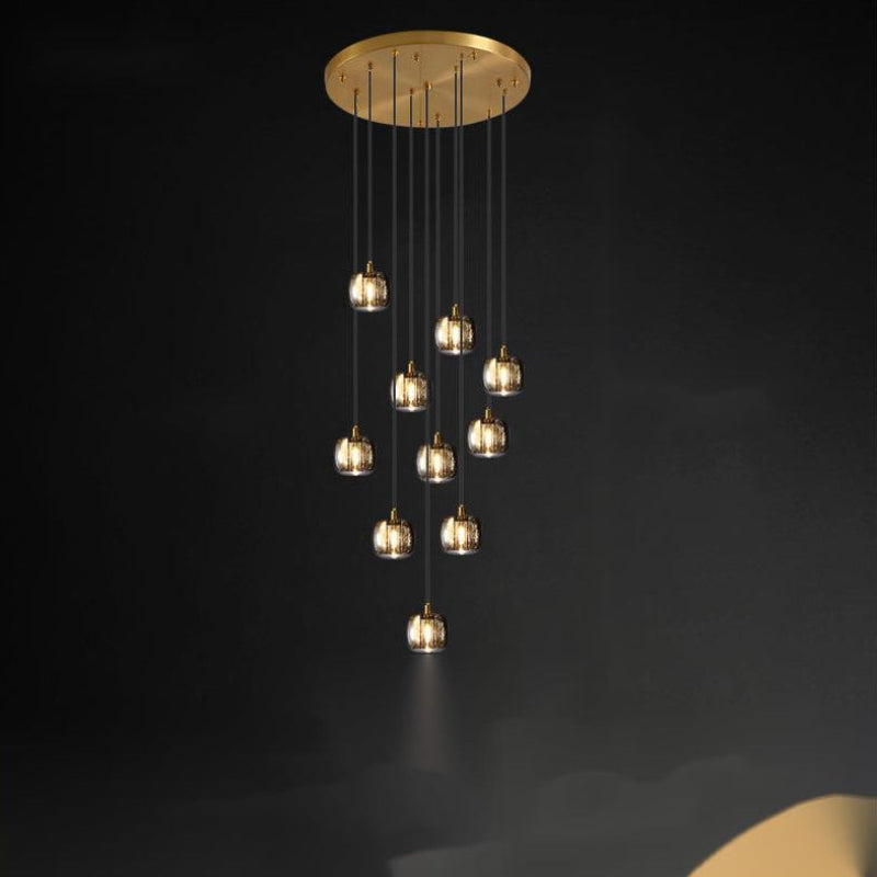 This black chandelier features randomly arranged crystal elements and square glass pendants, suitable for lighting high ceilings in stairwells, foyers, and entryways of two-story buildings.