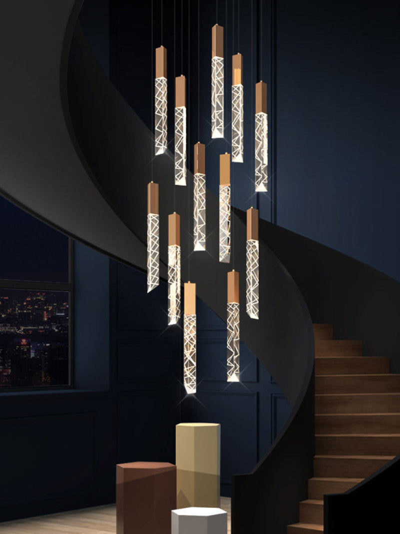 Gold-colored modern LED linear K9 crystal chandelier, featuring a waterfall design, suitable for stairwells, foyers, entryways, and spaces with high ceilings.