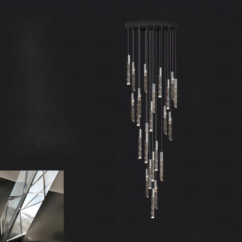 Black LED linear K9 crystal light fixture with rod design creating dramatic lighting for staircase foyer entryway two-story high ceiling