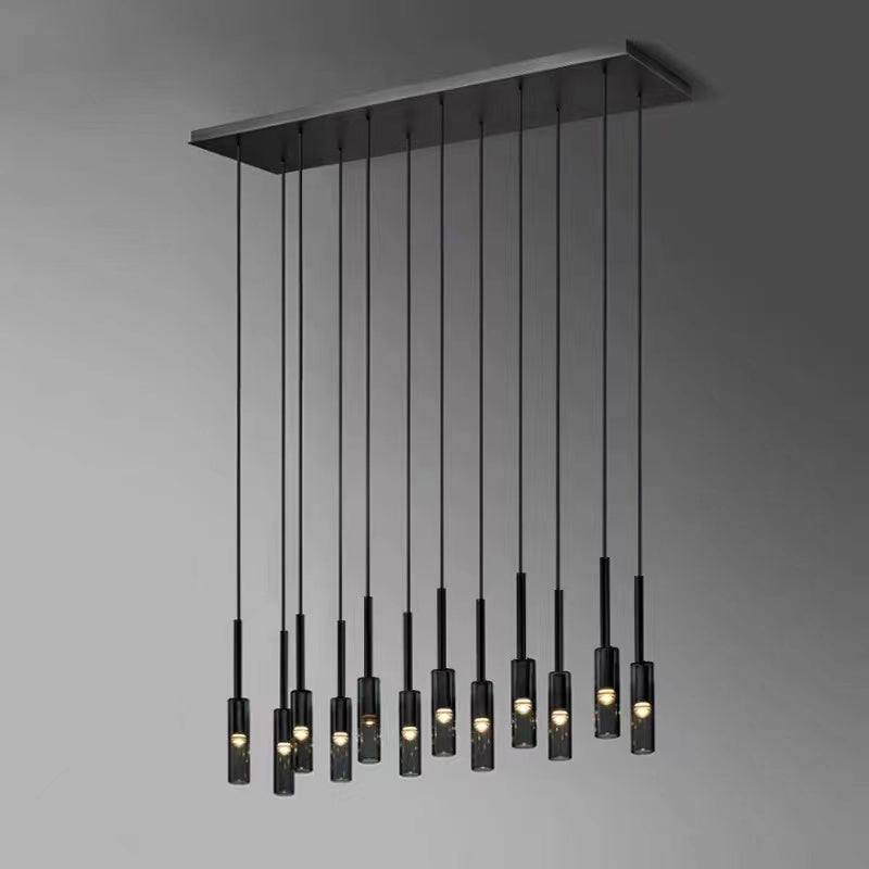 Black chandelier lighting with linear wire pendant and Italian copper creating minimalist ambiance for dining room kitchen island