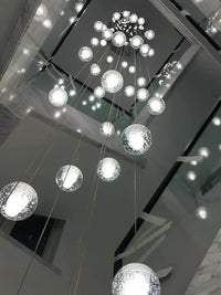 Thumbnail for Warm white dimmable LED crystal ball pendant viewed from below with random sphere arrangement for stairwell two-story high ceiling