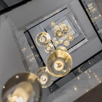 Thumbnail for Modern chrome bubble crystal chandelier with dimmable LED floating orbs creating contemporary foyer staircase entryway lighting