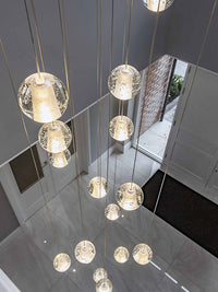 Thumbnail for UL-certified chrome bubble crystal chandelier with dimmable LED floating orbs and premium K9 crystals for stairwell foyer high ceiling