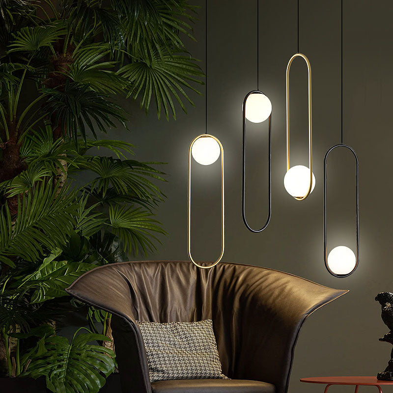 Bubble ball-shaped pendant light, shown in gold and black finishes, perfect for use in home spaces.