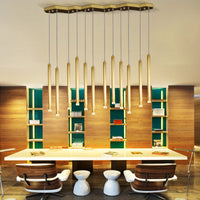 Thumbnail for This modern, minimalist linear pendant light is suitable for dining rooms.  Featuring a golden meteor shower design and seamless light tubes, it provides illumination for the dining table.