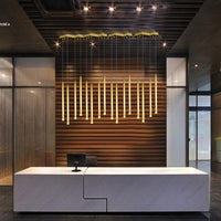 Thumbnail for Modern linear cylinder pendant light with meteor shower design in gold finish creating elegant lighting for kitchen island dining room