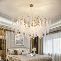 Thumbnail for Luxurious modern linear tree branch chandelier with copper design and art deco style lighting hanging above bedroom in neutral tones
