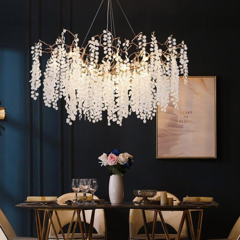 Modern linear tree branch chandelier with copper design and glass-like hanging leaves for dining room kitchen island table lighting