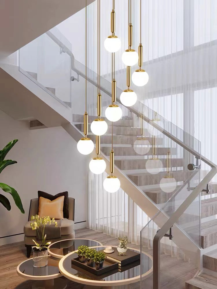 Modern unique staircase chandelier featuring creative bubble ball and LED glass pendant for foyer entryway two-story ceiling