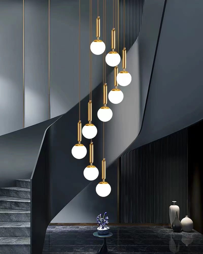 Modern unique bubble ball creative staircase chandelier with LED glass pendant creating elegant lighting for foyer entryway high ceiling