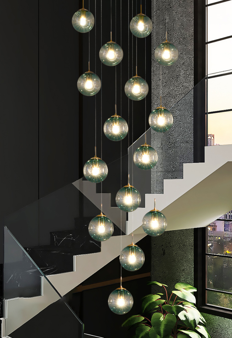 Contemporary foyer chandelier with handcrafted Murano-style bubbles in gradient blue for modern entryway staircase lighting