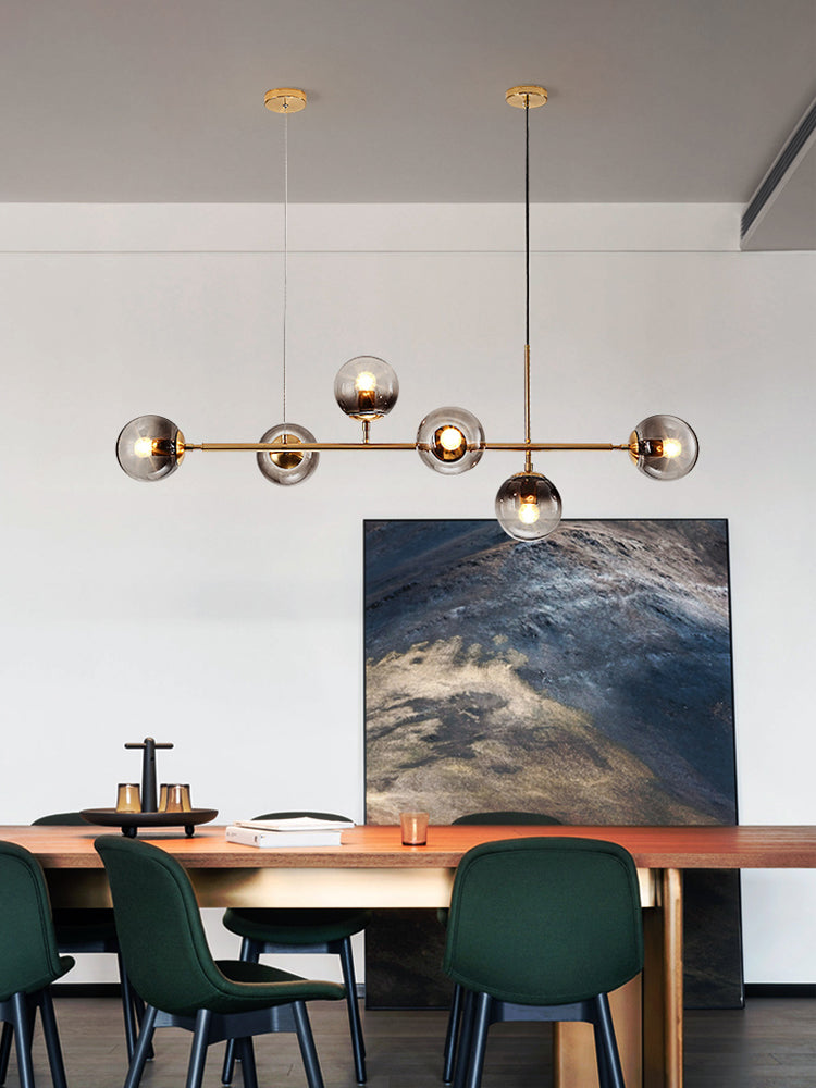 Bubble lights fixtures with Oloyoyo island design and glass ball pendant creating sophisticated lighting for dining room kitchen island
