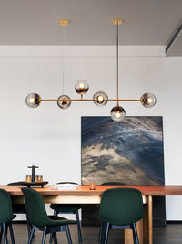 Thumbnail for Bubble lights fixtures with Oloyoyo island design and glass ball pendant creating sophisticated lighting for dining room kitchen island