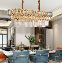 Thumbnail for Shantys' Emerald linear chandelier with sleek gold K9 crystals creating golden elegance for dining room kitchen island