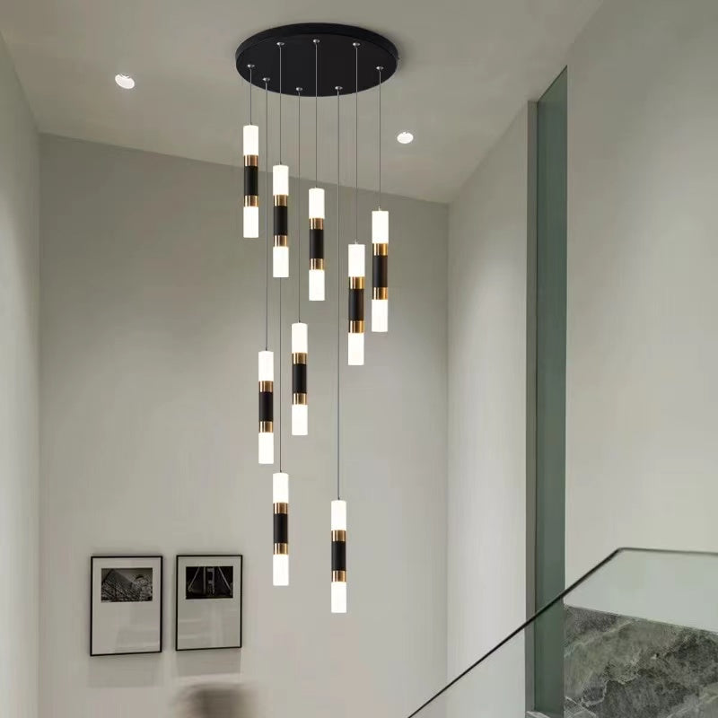 Spiral staircase crystal chandelier foyer pendant with cascading design creating elegant lighting for stairwell entryway high ceiling