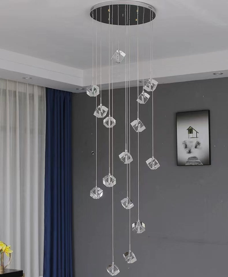 ice block chandelier creating mesmerizing light reflections for staircase foyer entryway lighting