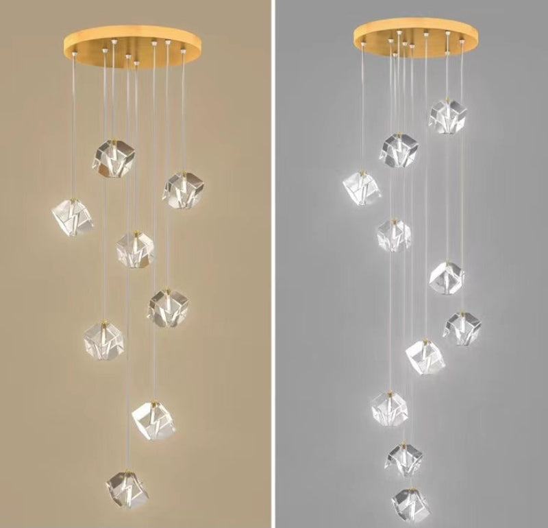 This handcrafted ice crystal chandelier adds an elegant touch to stairwells, foyers, and entryways. The image shows a comparison between a spiral and a random arrangement.
