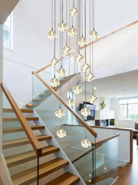 Thumbnail for Contemporary Arctic Drift ice cube chandelier with cascading crystal blocks suspended at varying heights for modern foyer lighting