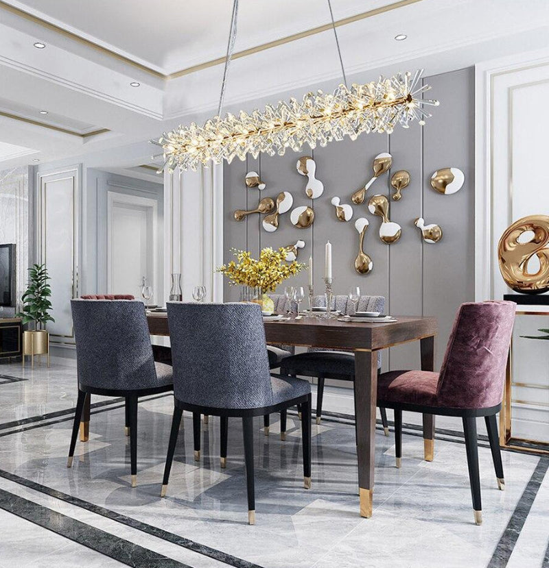 The Barb chandelier with electroplated gold and shape crystal creating artistic flair for modern dining room living room