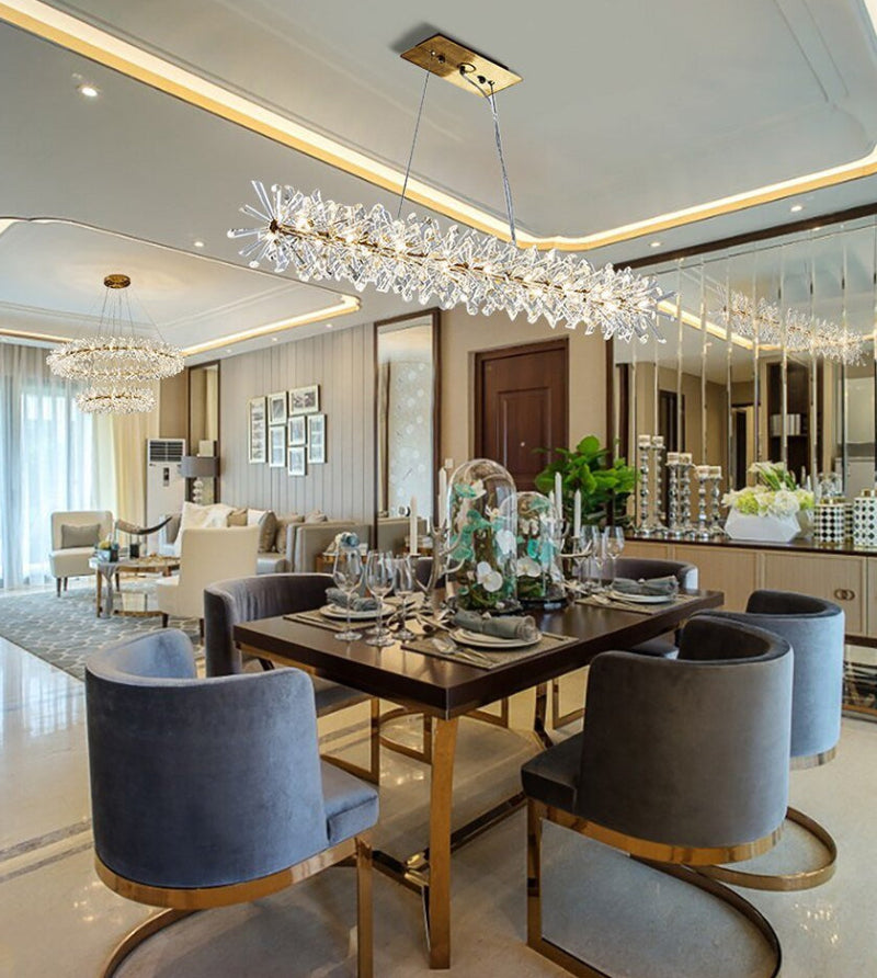 Electroplated gold chandelier with crystal wrapped outside creating simple elegant shapes for contemporary dining room living room