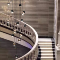 Thumbnail for Luxurious bronze truffle chandelier with cognac glass orbs creating sophisticated glow for staircase foyer high ceiling