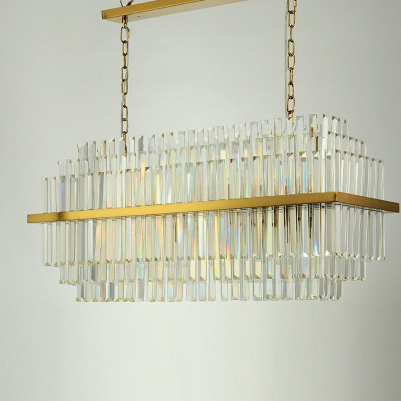 Brushed Tier chandelier with stainless steel and tiered K9 crystals creating luxury showpiece for dining room kitchen island