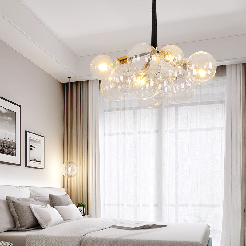 Bubbles chandelier with Bubble Ball glass sphere design creating elegant lighting for modern dining room foyer