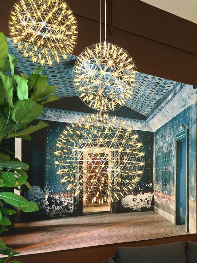 Chrome-plated LED firework/starburst pendant light, featuring a dandelion-inspired design, suitable for hallways, foyers, and other spaces.