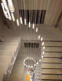 Thumbnail for Crystal raindrop chandelier lighting with Champagne Rain gold powder in spiral arrangement for staircase foyer entryway two-story ceiling