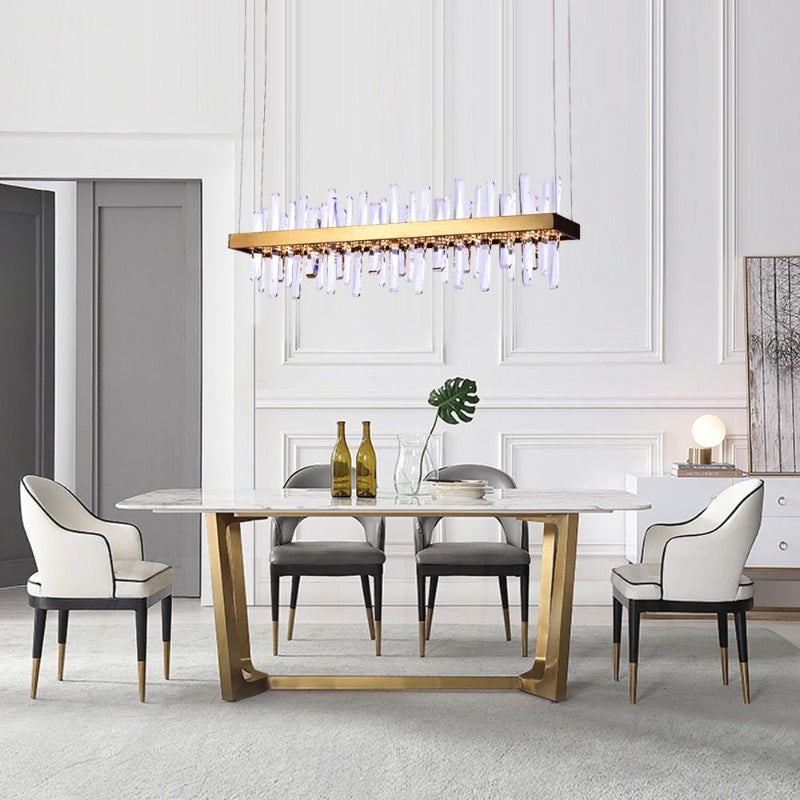 Brushed gold kitchen chandelier featuring Crystal Bar design with linear arrangement for contemporary kitchen island dining area