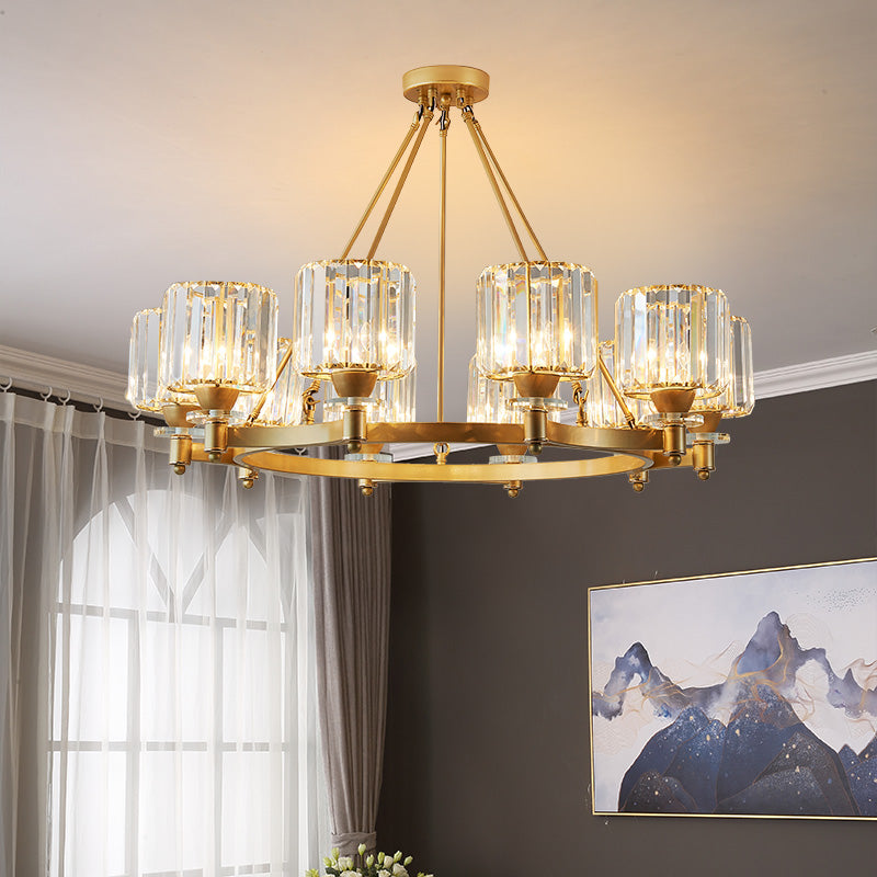 A modern crystal chandelier with black and gold accents, featuring clear glass shades and LED lighting, suspended by a circular gold canopy.
