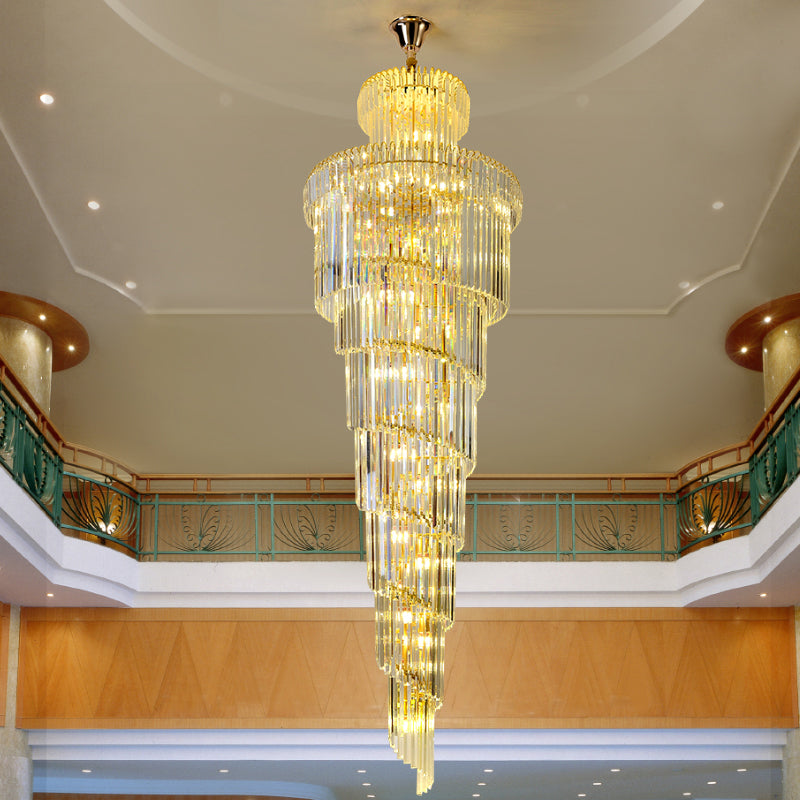 Large K9 crystal spiral chandelier with circular design creating brilliant sparkle for grand staircase entryway two-story foyer