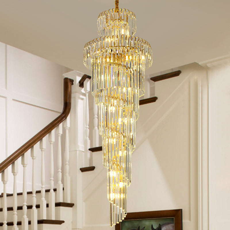 Large circular crystal spiral chandelier with cascading design creating palatial elegance for hotel lobby mansion staircase