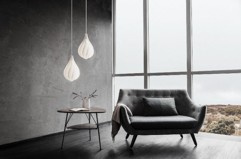 Glass chandelier with Danish Minimalist teardrop spiral design creating minimalist Nordic lighting for contemporary dining room foyer