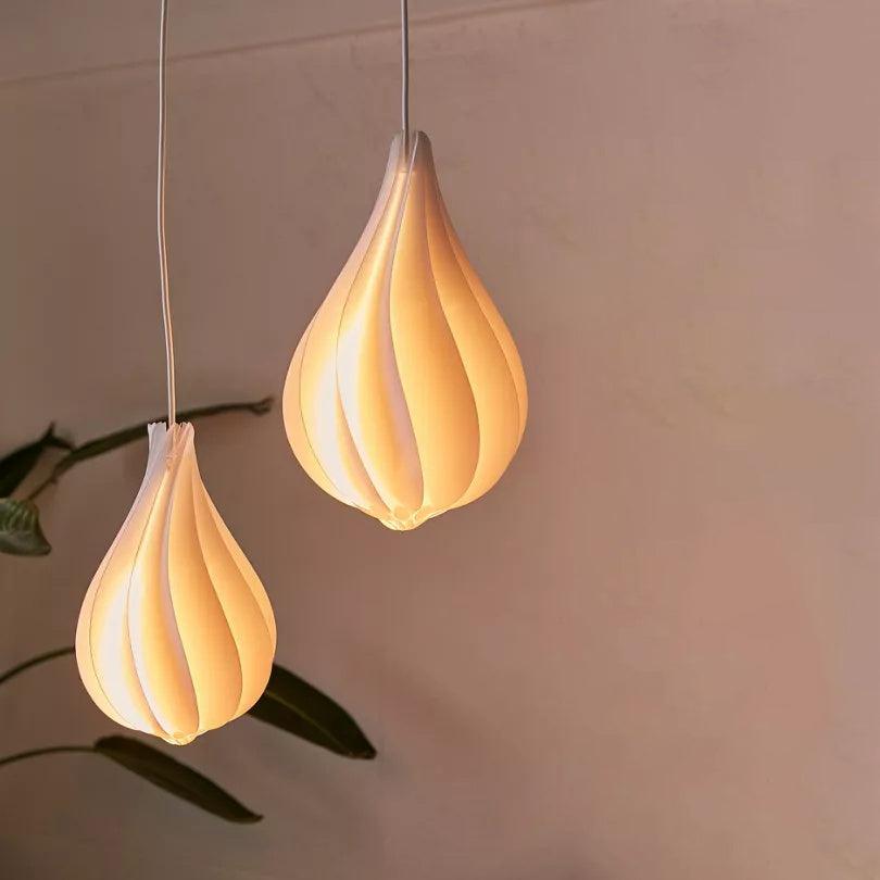Danish Minimalist teardrop spiral pendant light with round chandelier design creating modern Scandinavian lighting for dining room foyer