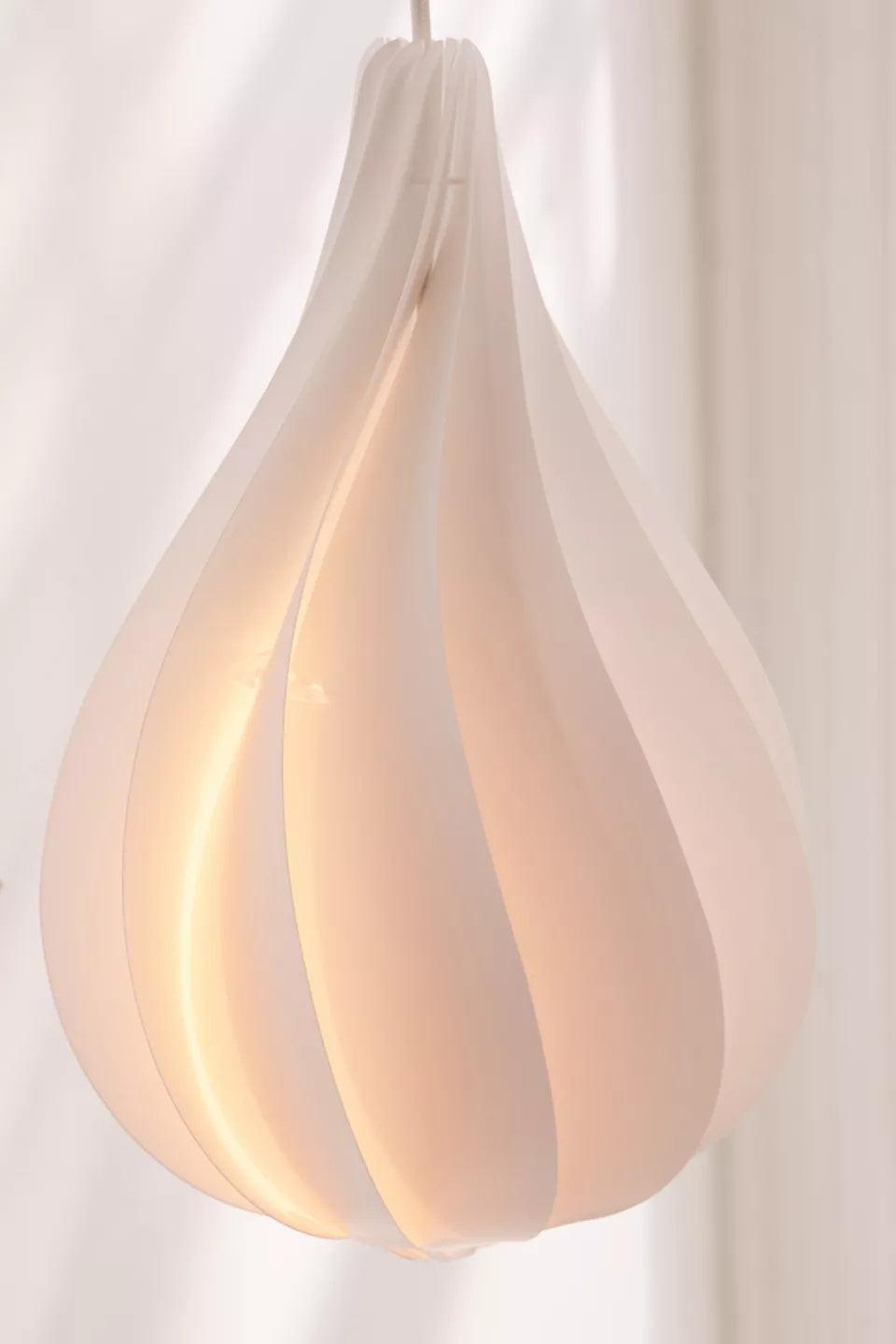 Clear bubble chandelier featuring Danish Minimalist teardrop spiral pendant creating sleek Scandinavian ambiance for modern living space