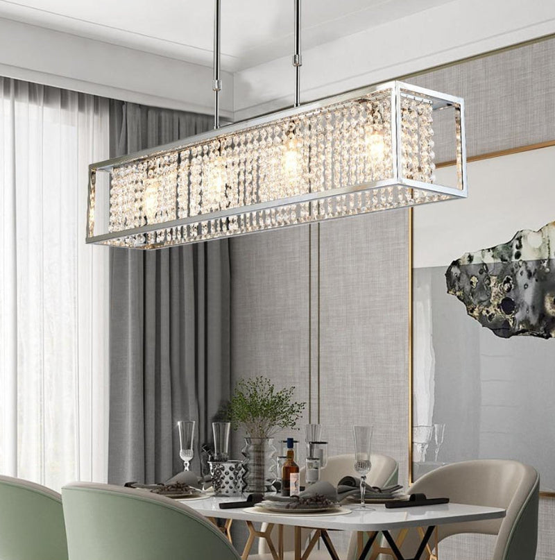 Linear gold K9 crystal chandelier with encapsulated design creating sophisticated atmosphere for elegant dining room foyer
