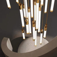 Thumbnail for Modern tubular chandelier featuring cascading acrylic tubes in brass finish for contemporary staircase foyer entryway lighting