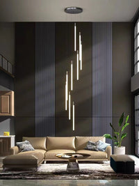 Thumbnail for Brass tubular cascade with high-transparency acrylic creating flowing light sculpture for contemporary staircase foyer entryway