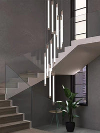 Thumbnail for Cascading acrylic chandelier with tubular design creating ethereal luminescence for modern staircase foyer two-story high ceiling