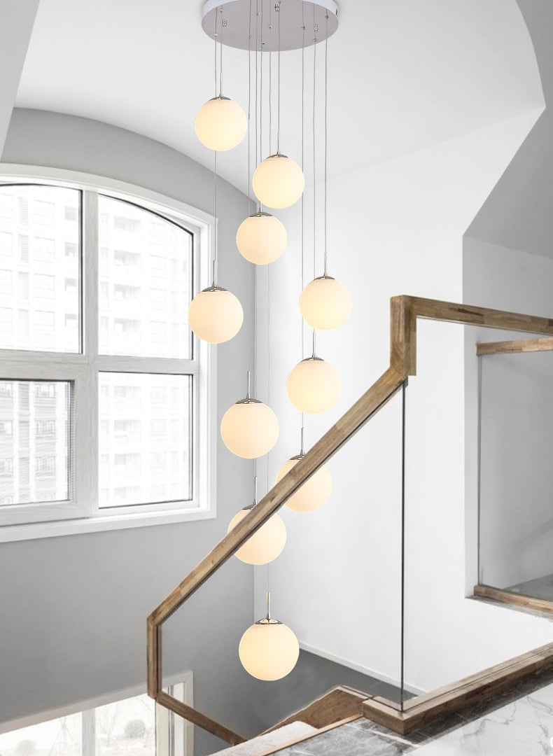 Frosted Cascade bubble ball chandelier with cascading design creating refined lighting for modern dining room foyer high ceiling