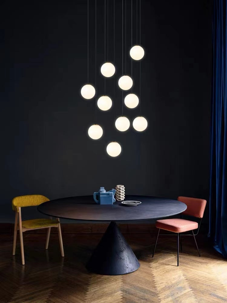 Modern chandelier with Frosted Cascade bubble ball design creating sophisticated lighting for dining room foyer contemporary space
