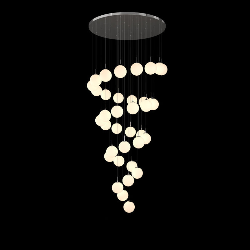 Modern bubble ball chandelier with Frosted Cascade design creating refined lighting for dining room foyer high ceiling