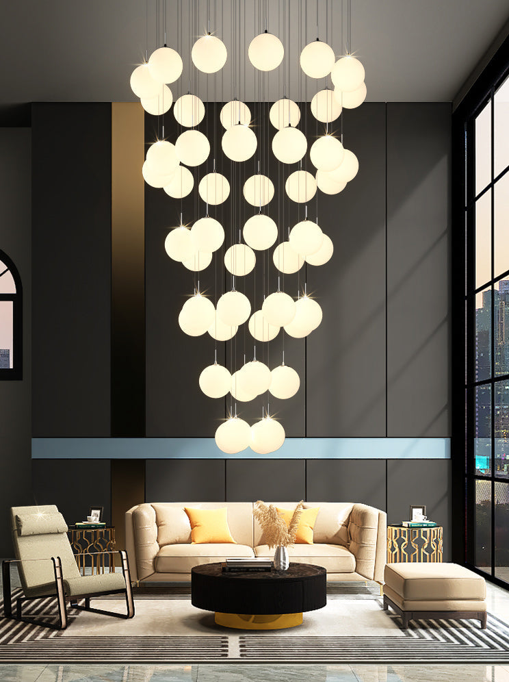 Frosted glass bubble chandelier with Cascade design creating sophisticated lighting for modern dining room foyer entryway