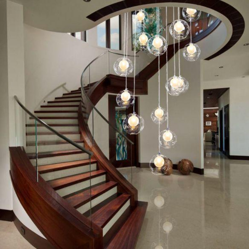Frosted mosaic ball chandelier light with sphere bubble design creating romantic glow for spiral stairway foyer entryway