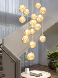 Thumbnail for Multi-light bubble fixture with glass spheres creating firefly movement for contemporary staircase foyer entryway two-story space