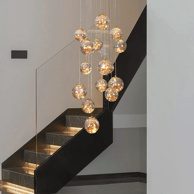 Unique glass bubble chandelier with firefly-inspired arrangement creating artistic focal point for staircase foyer entryway lighting