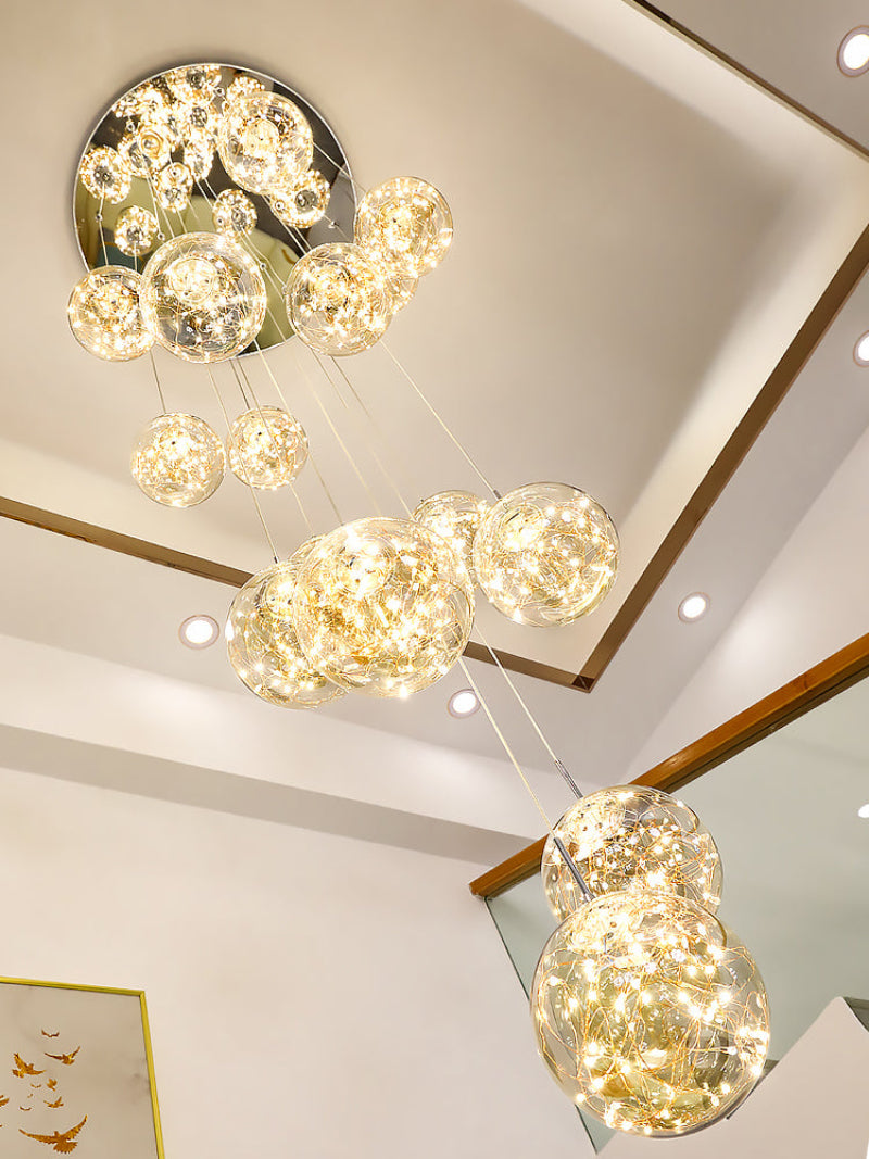 Bubble lighting fixture with adjustable glass balls creating firefly-like ambiance for modern staircase foyer entryway high ceiling
