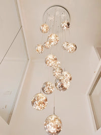 Thumbnail for Glass bubble chandelier cluster with firefly-inspired design creating mesmerizing glow for staircase foyer entryway two-story ceiling